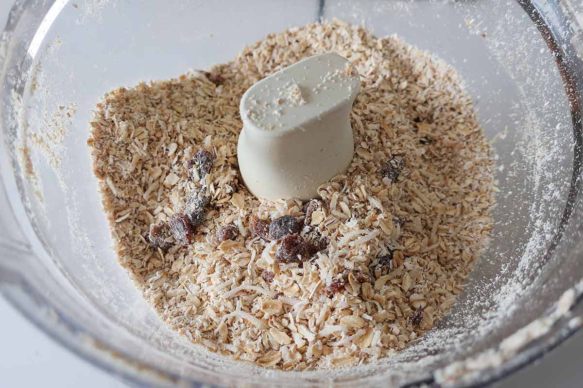 oats, raisins and coconut in a food processor bowl