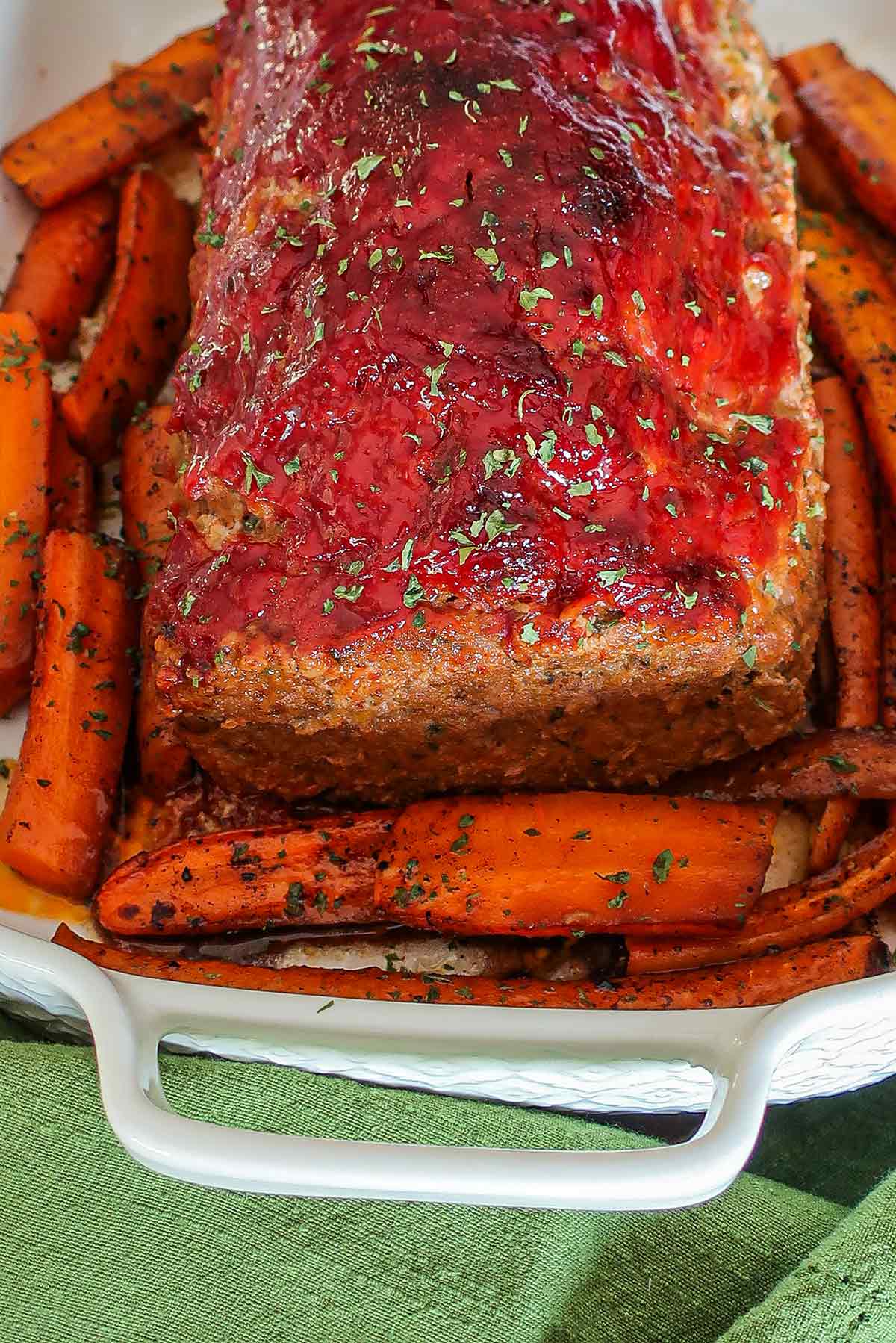 gluten free meatloaf on a serving dish with carrots