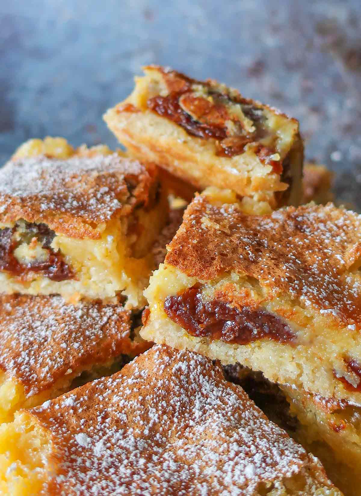 stacked gluten free raisin lemon bars on a plate