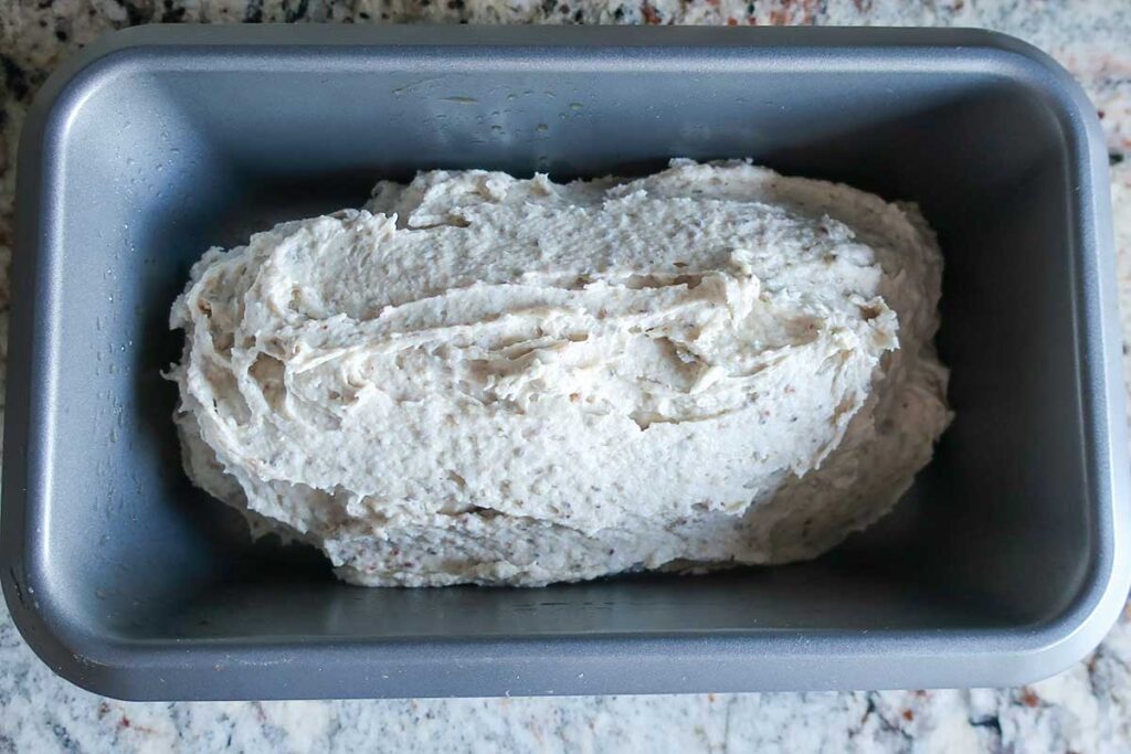 bread dough in a loaf pan before rising