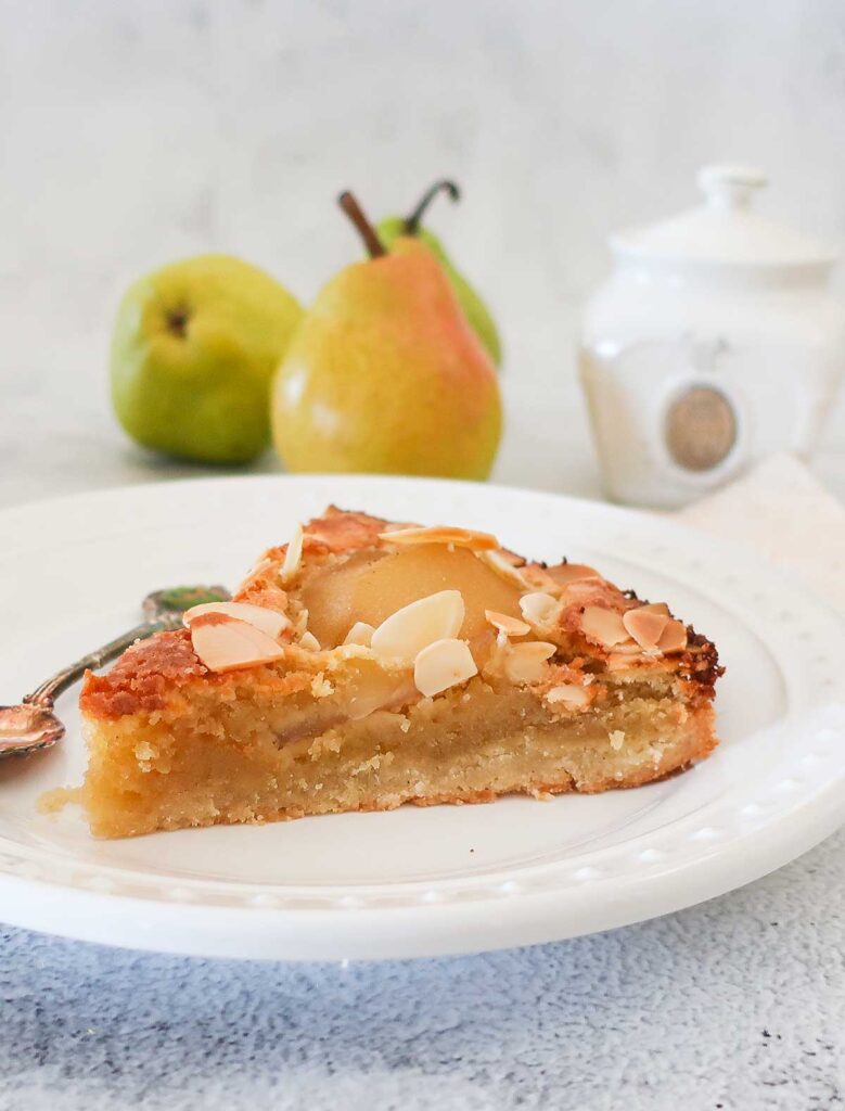 a slice of Pear and Almond Frangipane Cake on a plate, gluten free