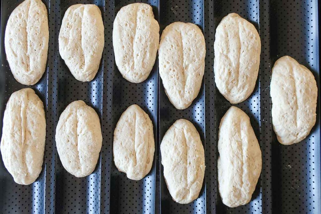 shaped Portuguese rolls on a baguette pan