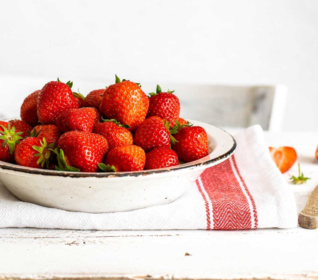 fresh strawberries in a bowl for strawberry desserts