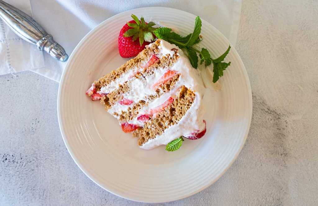 a slice of strawberry icebox dessert on a plate