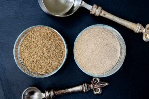 2 glass jars filled with active dry yeast and instant yeast