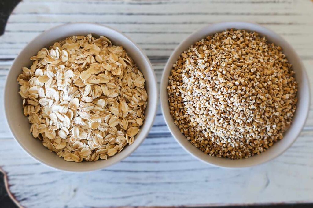 showing whole oats and steel cut oats in two bowls