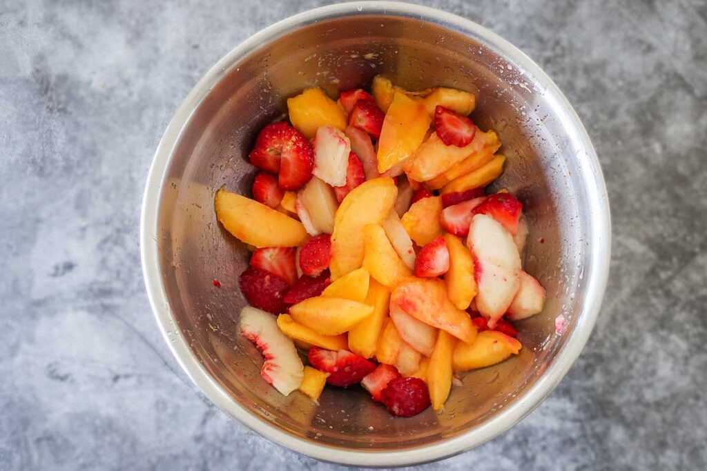 peaches and strawberries in a bowl