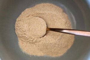 psyllium husk powder in a bowl with a spoon