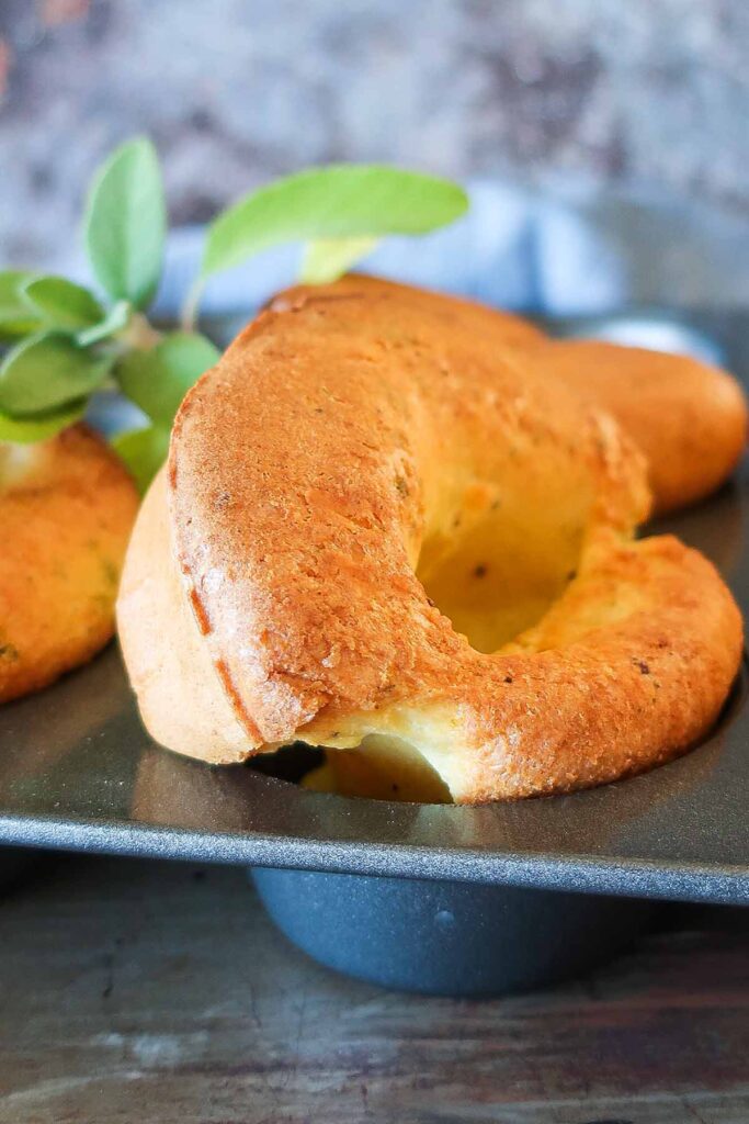 1 baked parmesan popover in a muffin pan