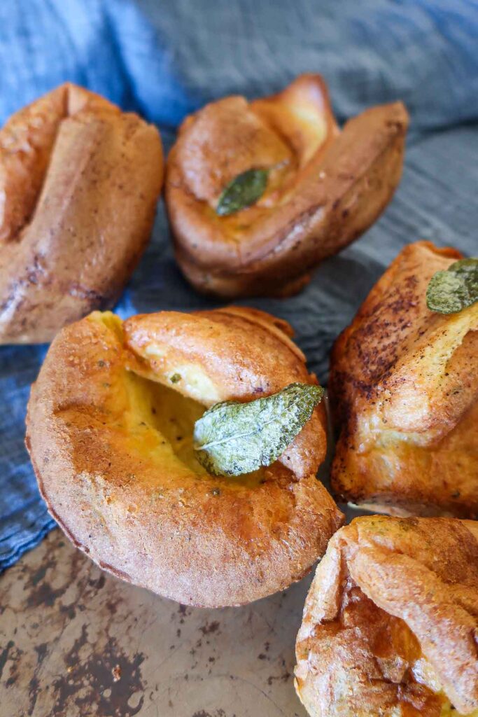 gluten free rosemary cheese popovers topped with sage