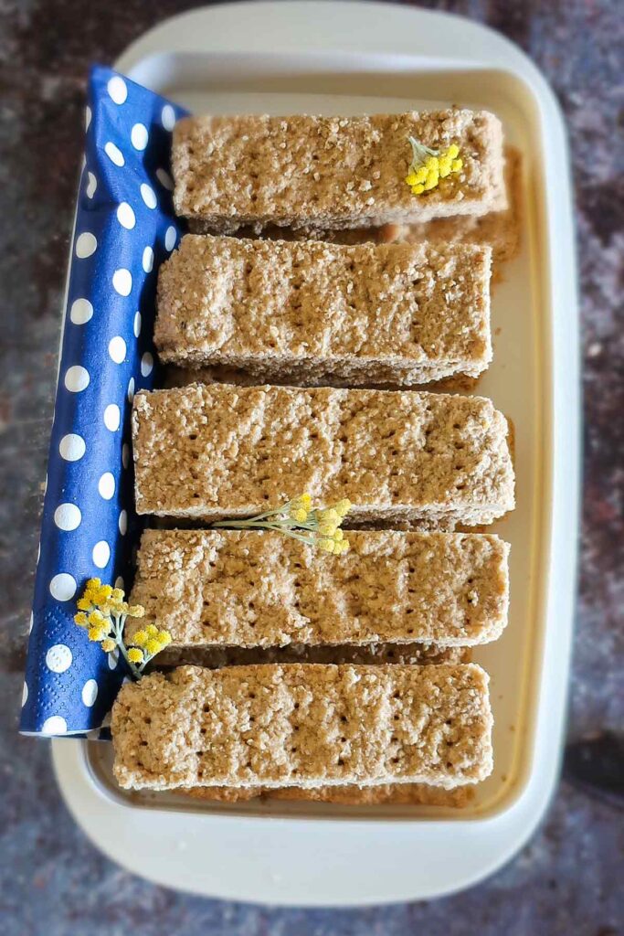 shortbread maple oat bars in a plastic container