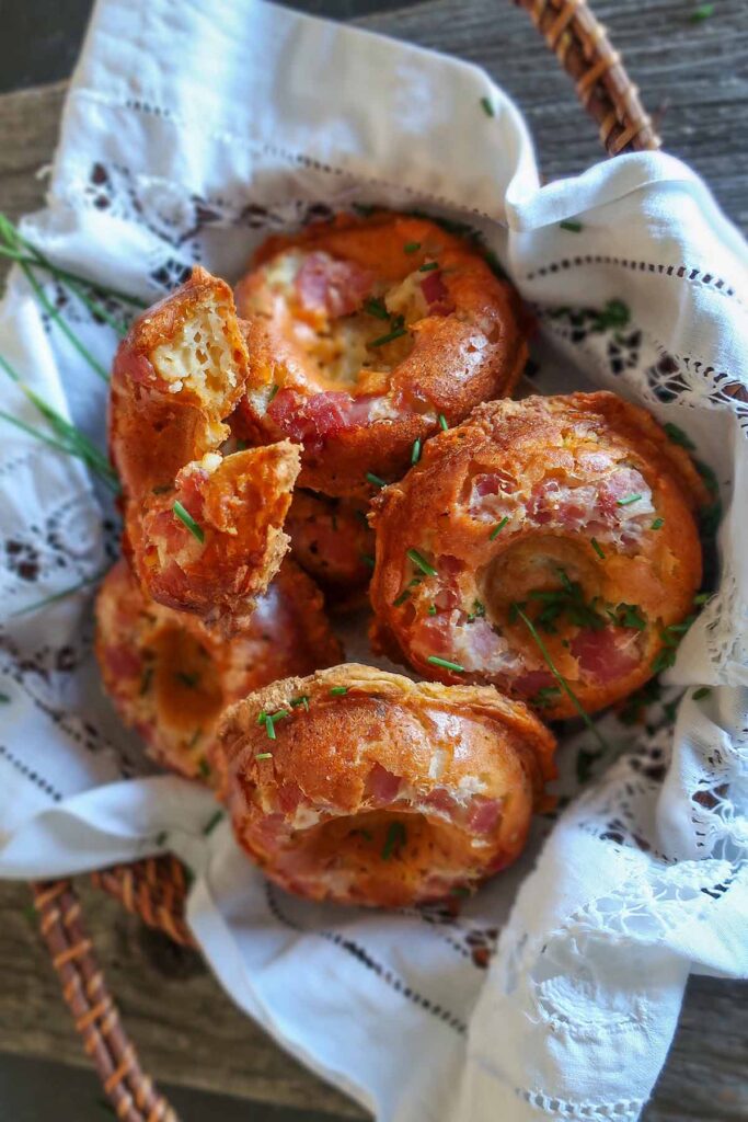 showing close up of half baked bacon and cheese donut