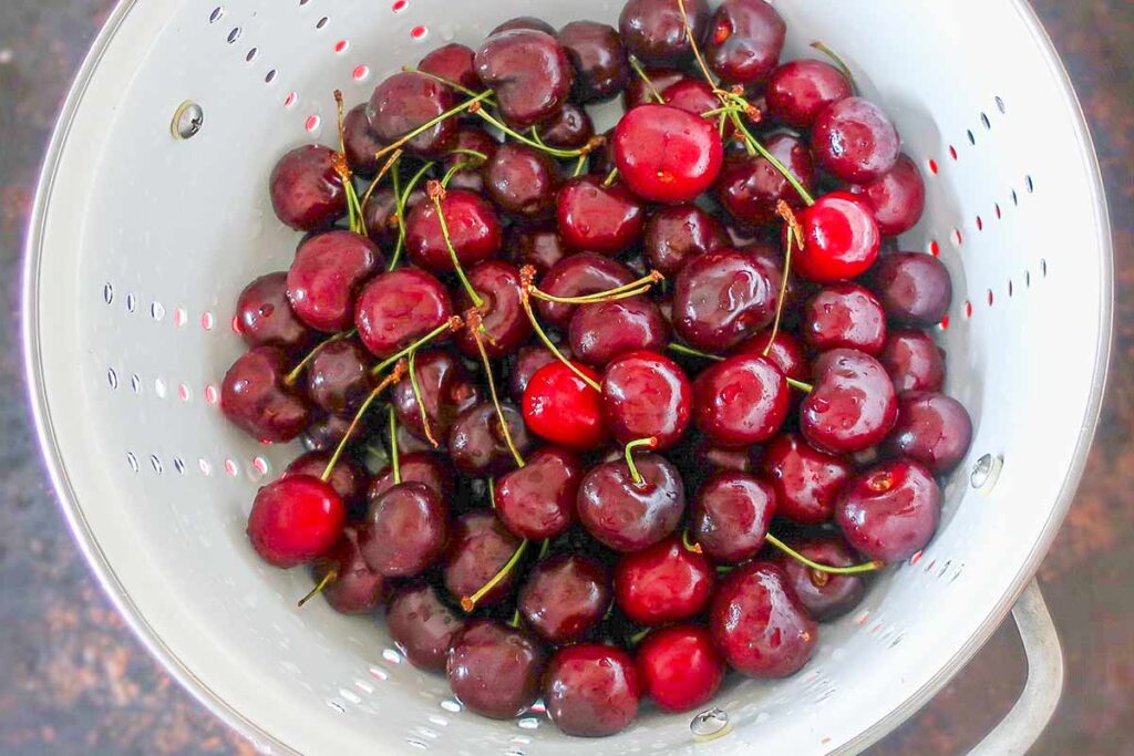 cherries in a colander