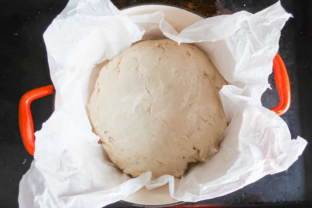 bread dough in a pot before proofing