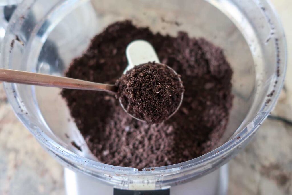 ground oreo cookies on a spoon