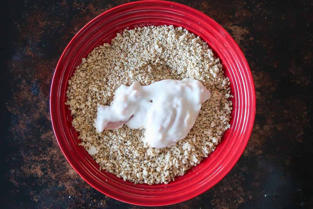 chicken coated in buttermilk paste and dipped in bread crumbs