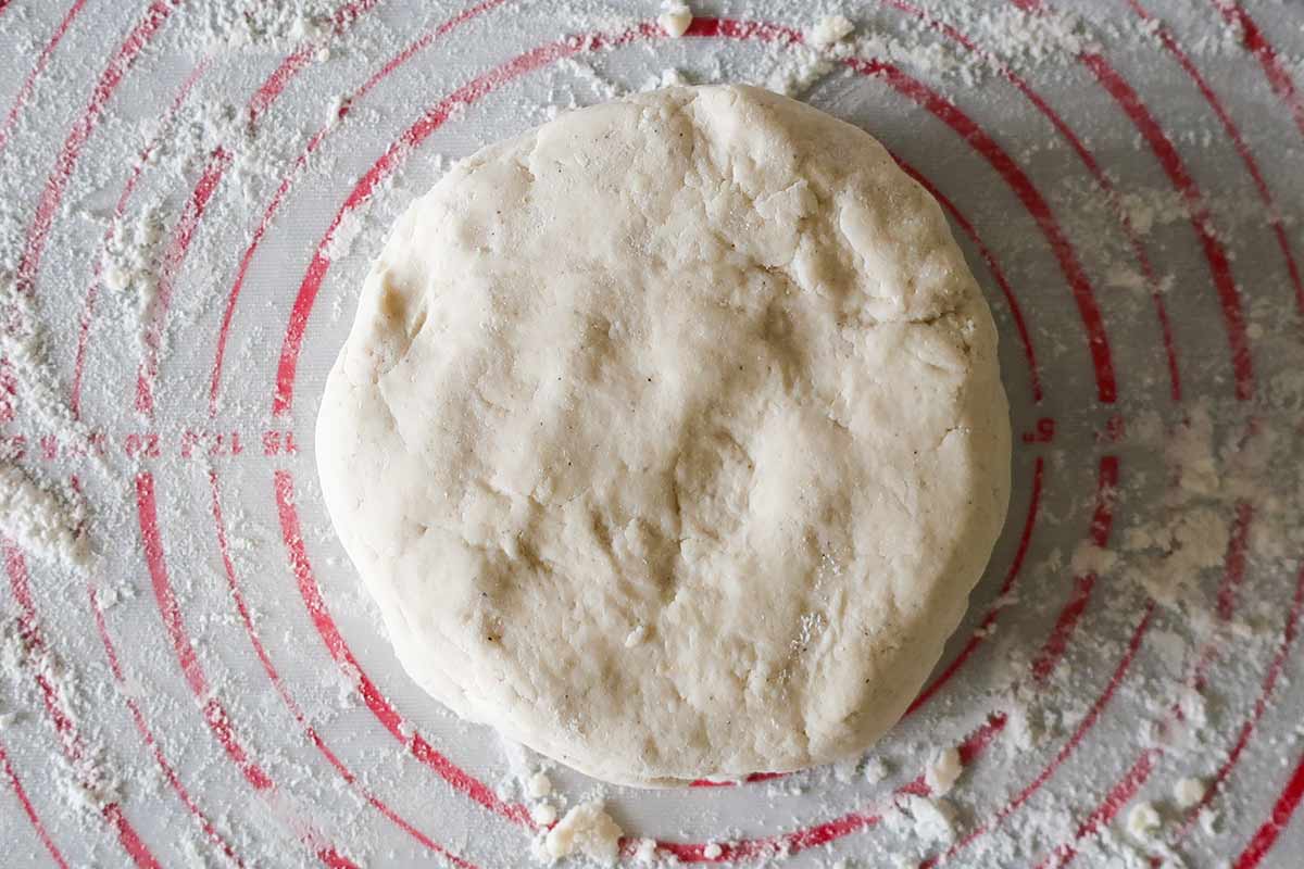 food processor pie dough shaped into a disk