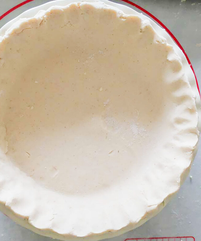 smooth unbaked food processor pie crust in a pie dish