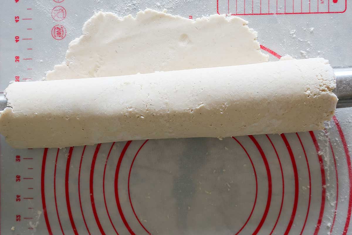 rolled pie crust dough on a rolling pin