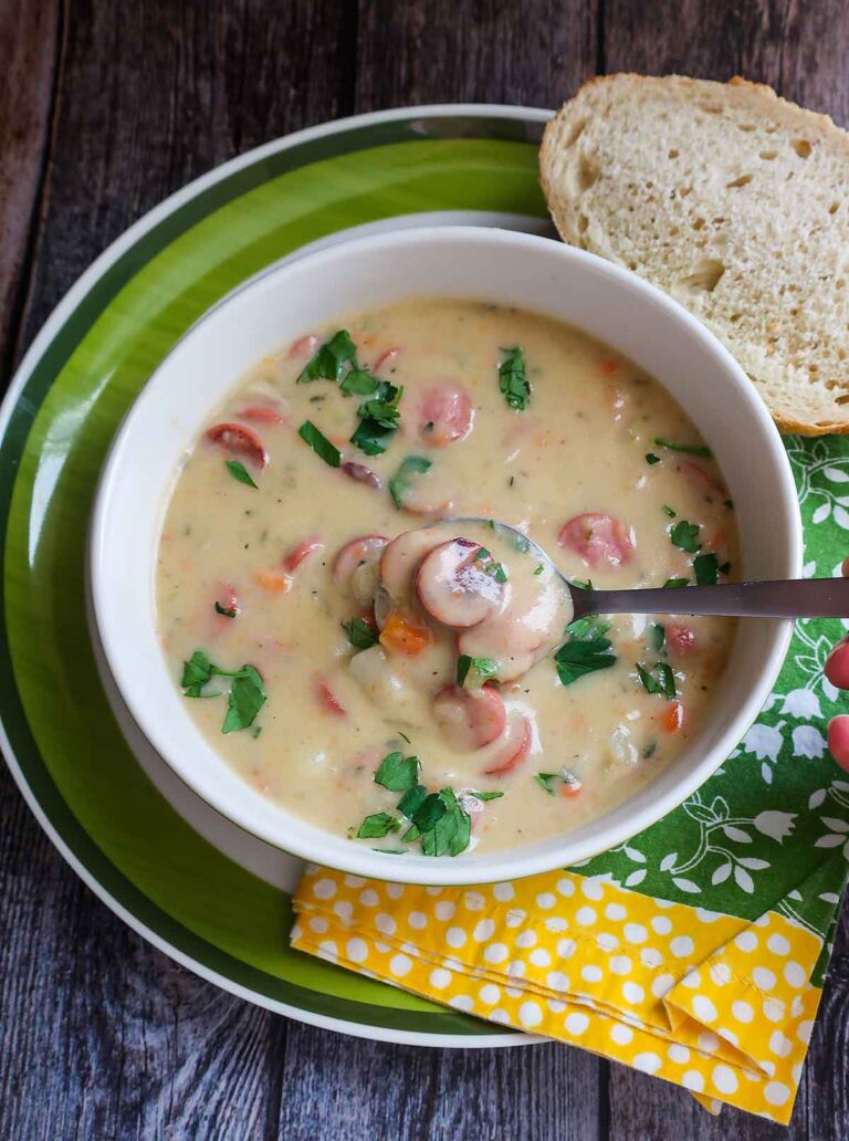 German potato soup with winers in a bowl with a slice of bread