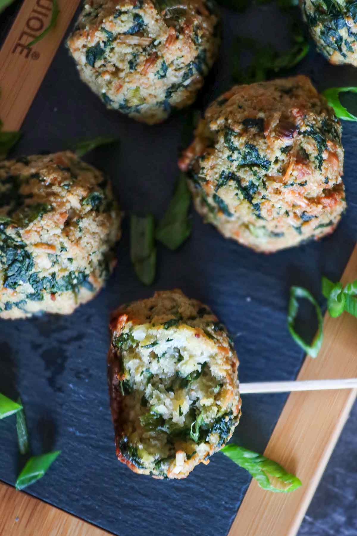 spinach balls on a serving tray