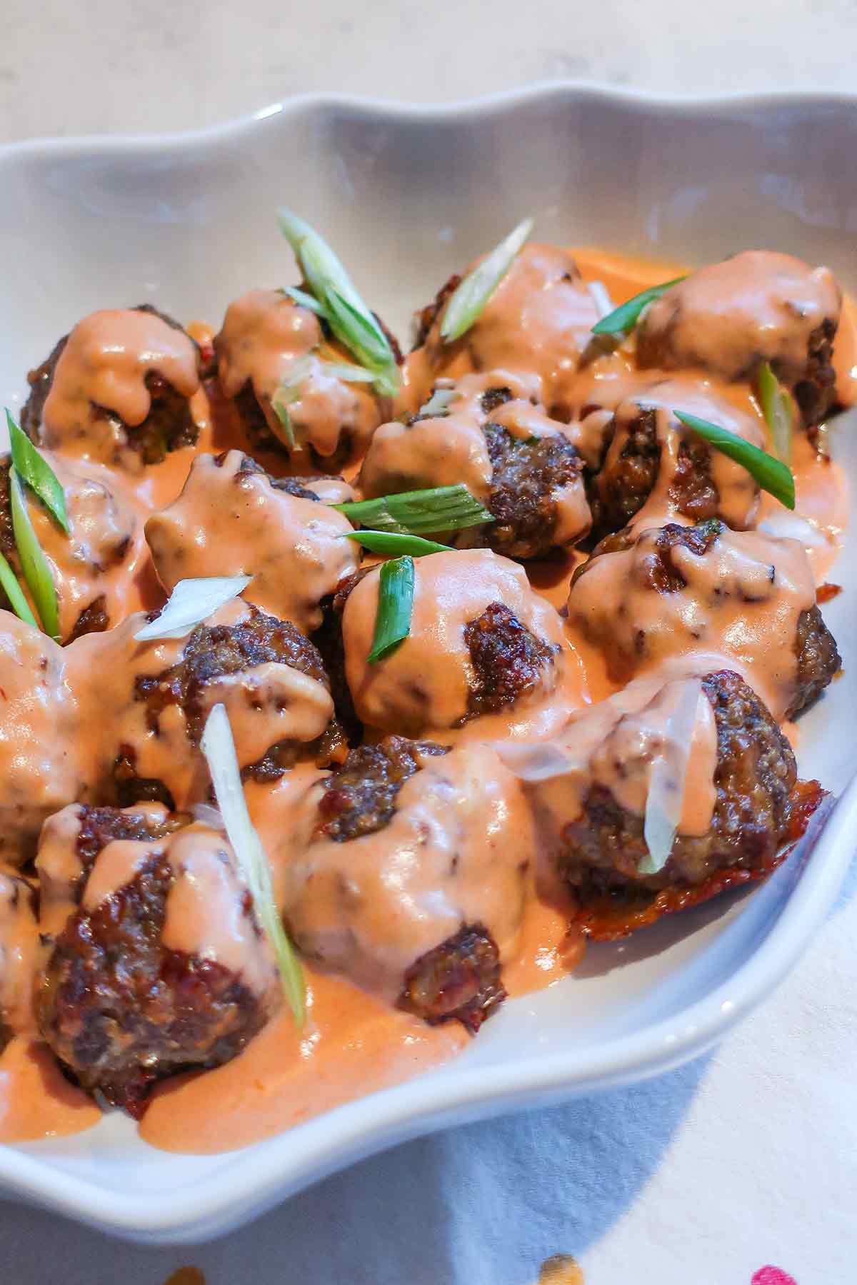 sweedish meatballs with sauce on a platter