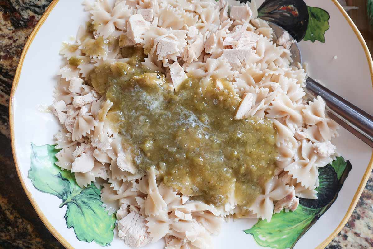 pasta, chicken and salsa verde in a bowl
