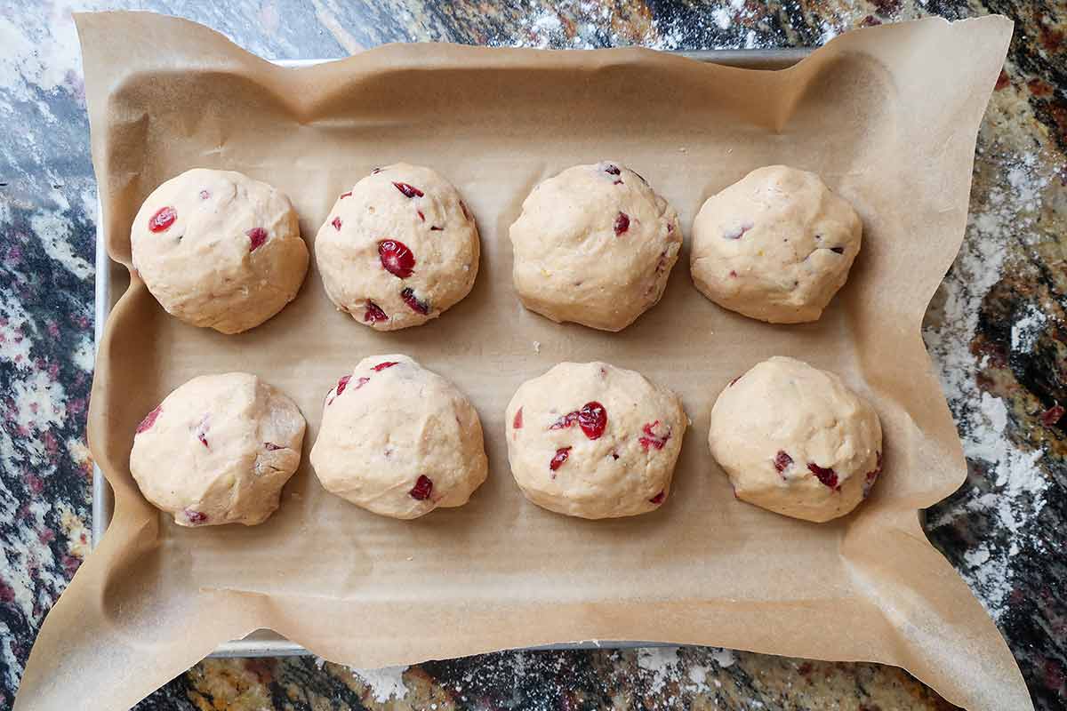 8 balls of dough on a baking tray 