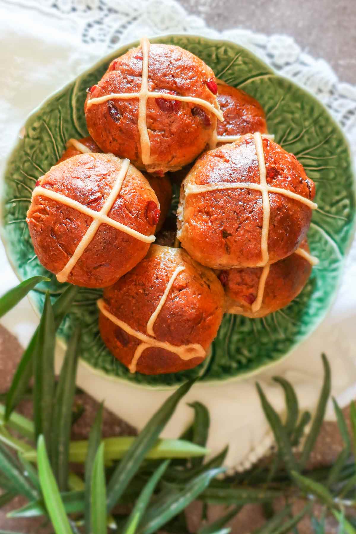 stacked cross buns on a plate 