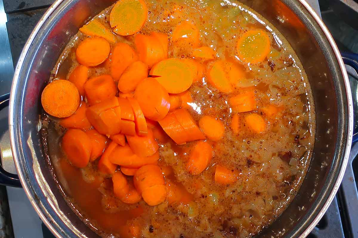 carrots simmering in a broth
