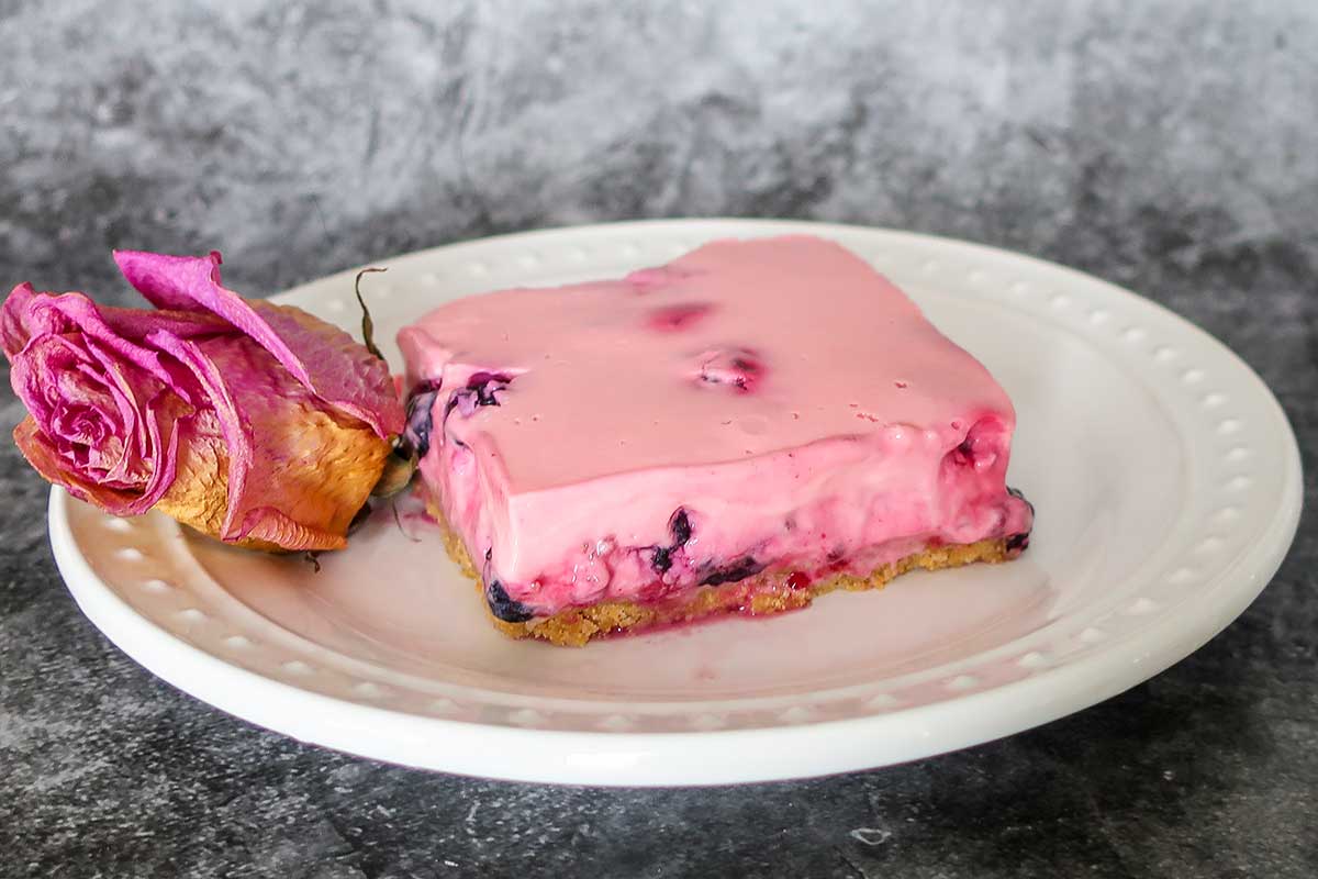 creamy berry squares on a plate