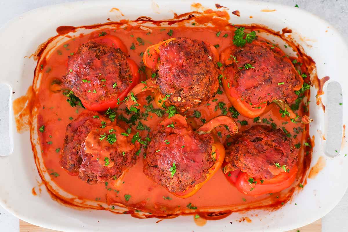 6 baked stuffed peppers in a baking dish