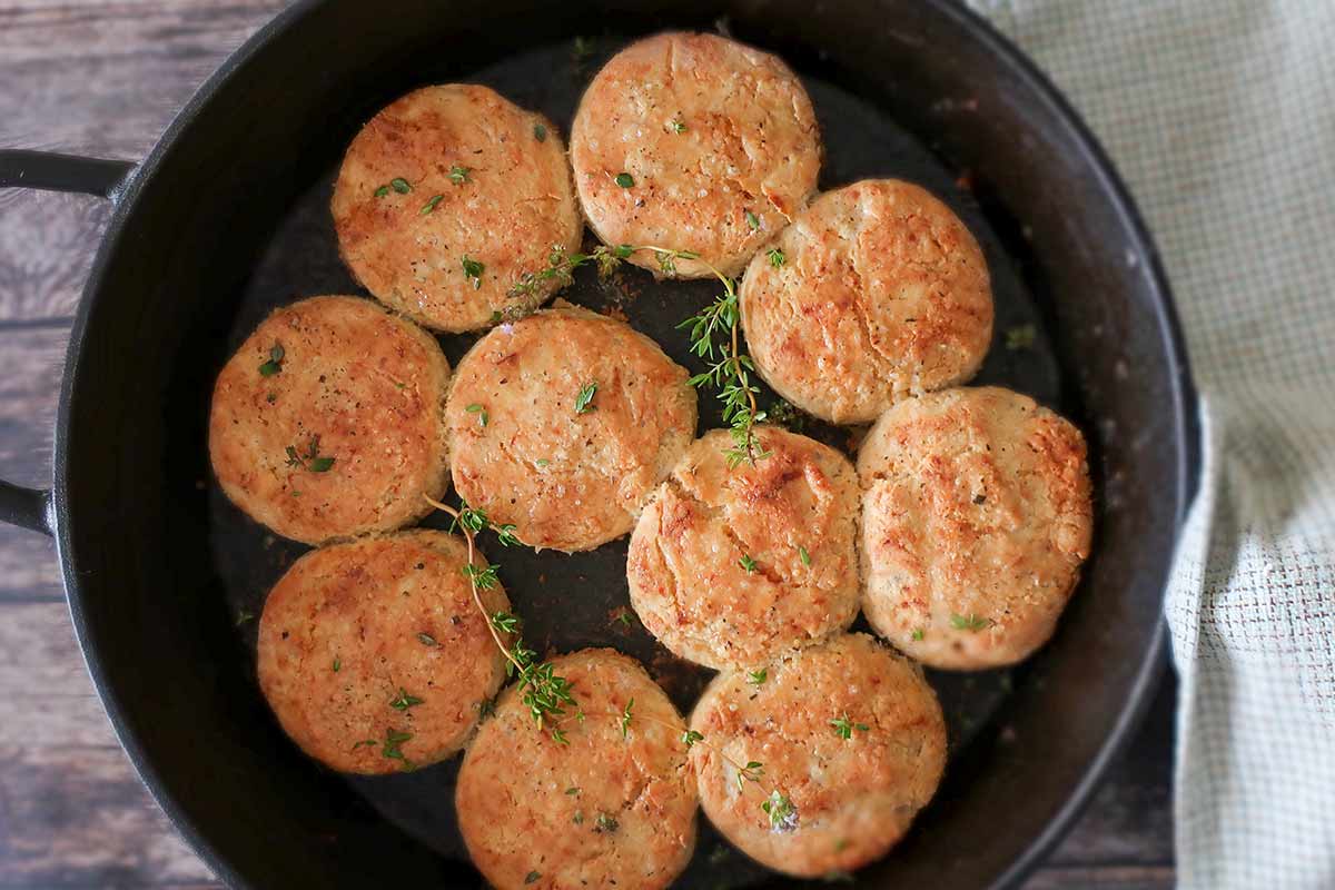 baked biscuits in a skillet brushed with honey butter