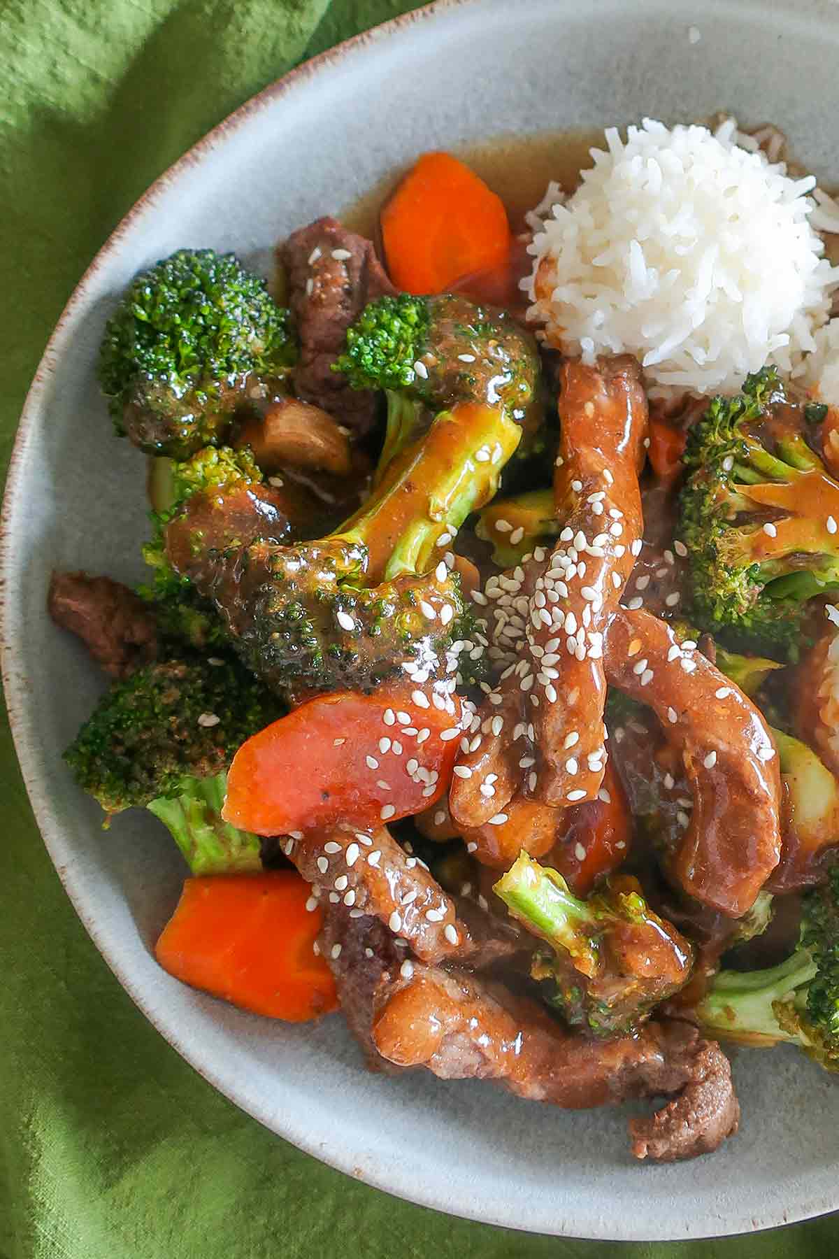 baked beef and broccoli with rice in a bowl