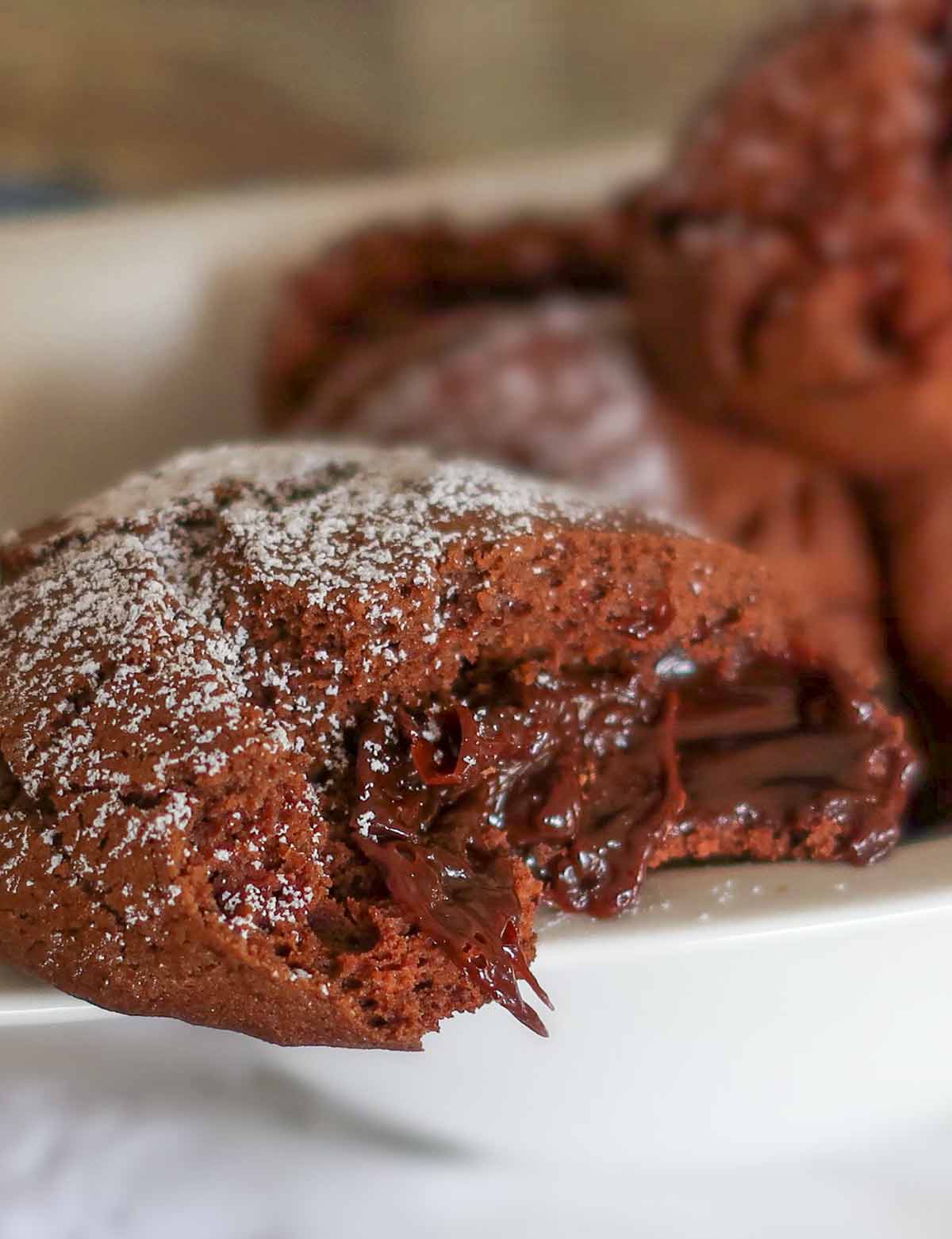 one chocolate molten cookie showing melted chocolate sauce