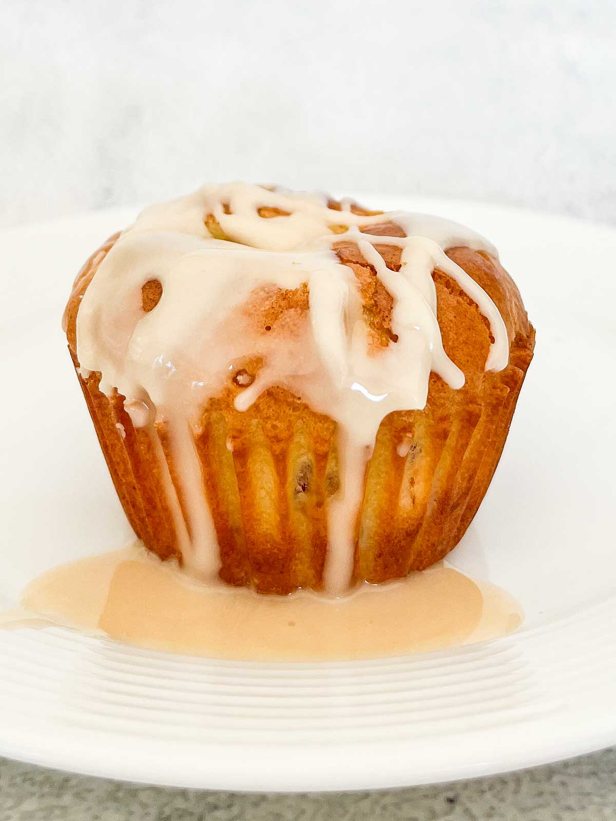 single muffin with vanilla drizzle