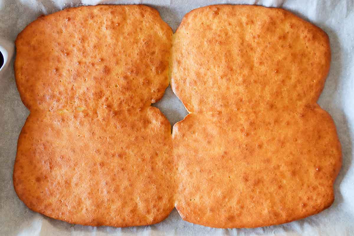 4 baked mini flatbread portions on a baking sheet