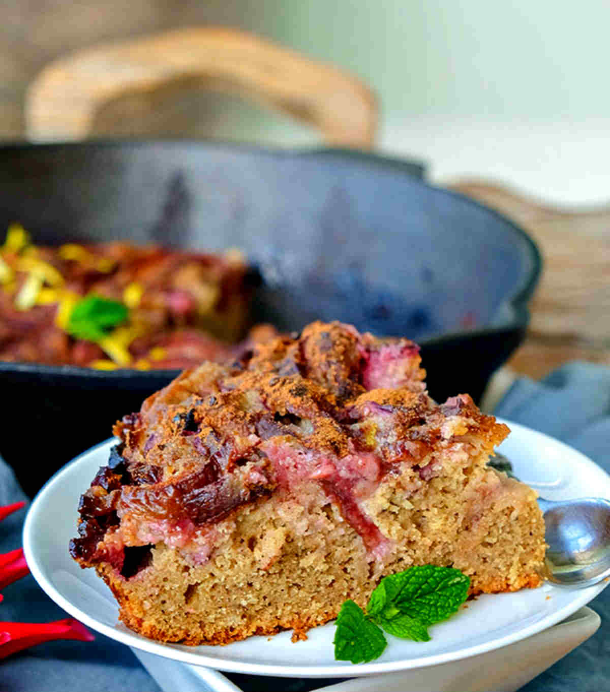 slice of gluten free plum skillet country cake on a plate