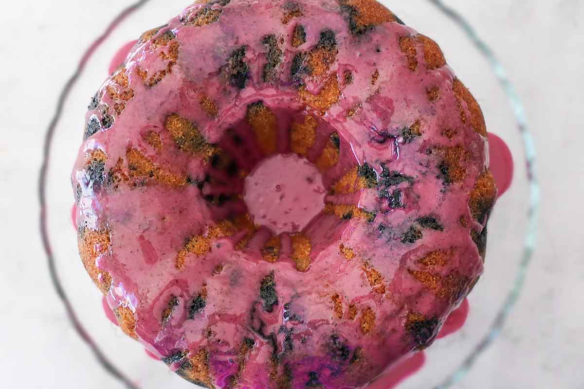 bundt cake drizzled with blueberry orange glaze