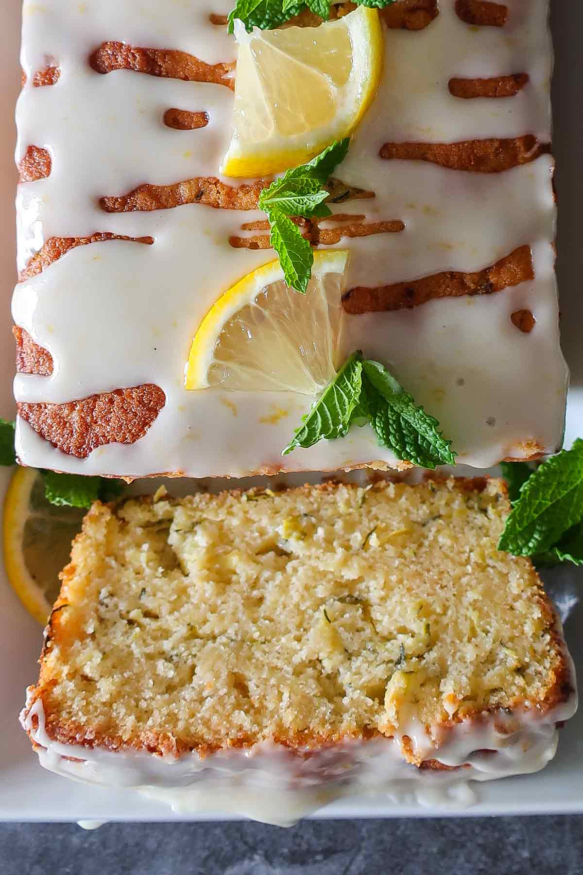 close up of a slice from zucchini lemon rice flour loaf