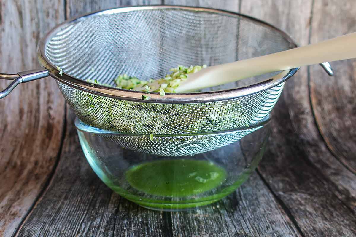 zucchini draining in a colander