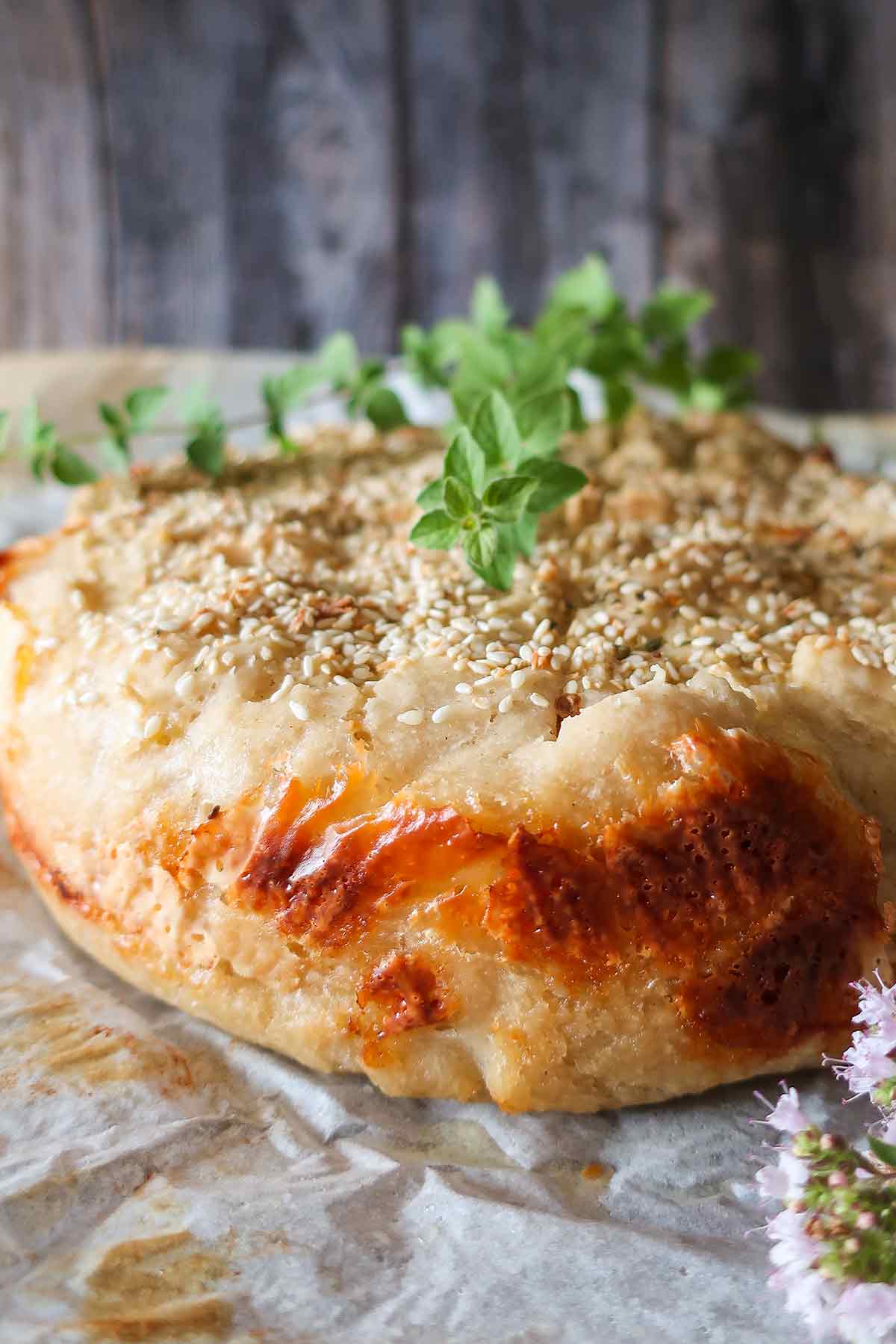 round loaf of baked greek cheese bread