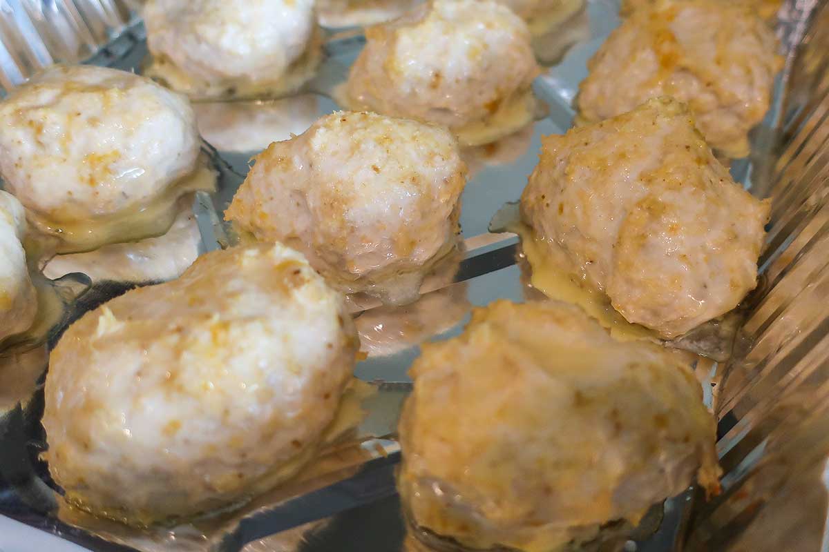 baked chicken meatballs in a baking dish