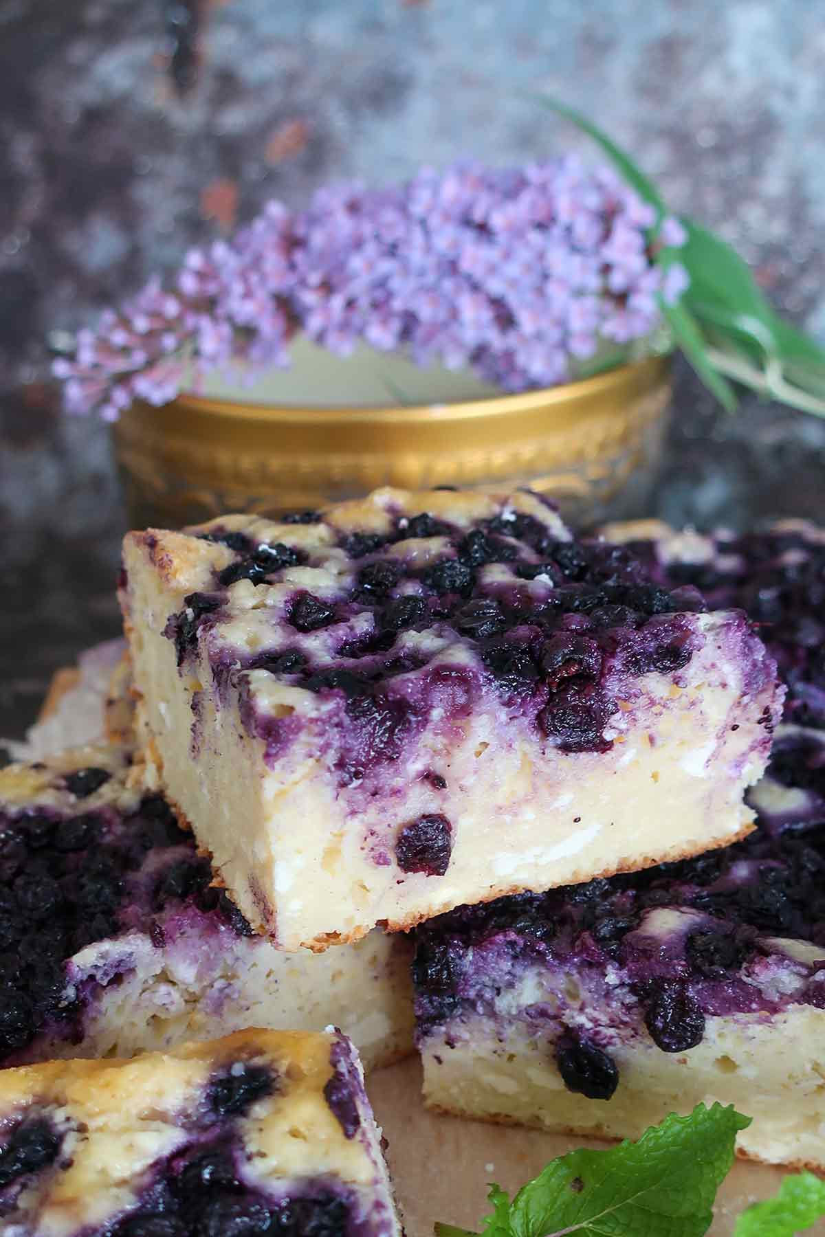 close up of 1 slice of cottage cake with blueberries