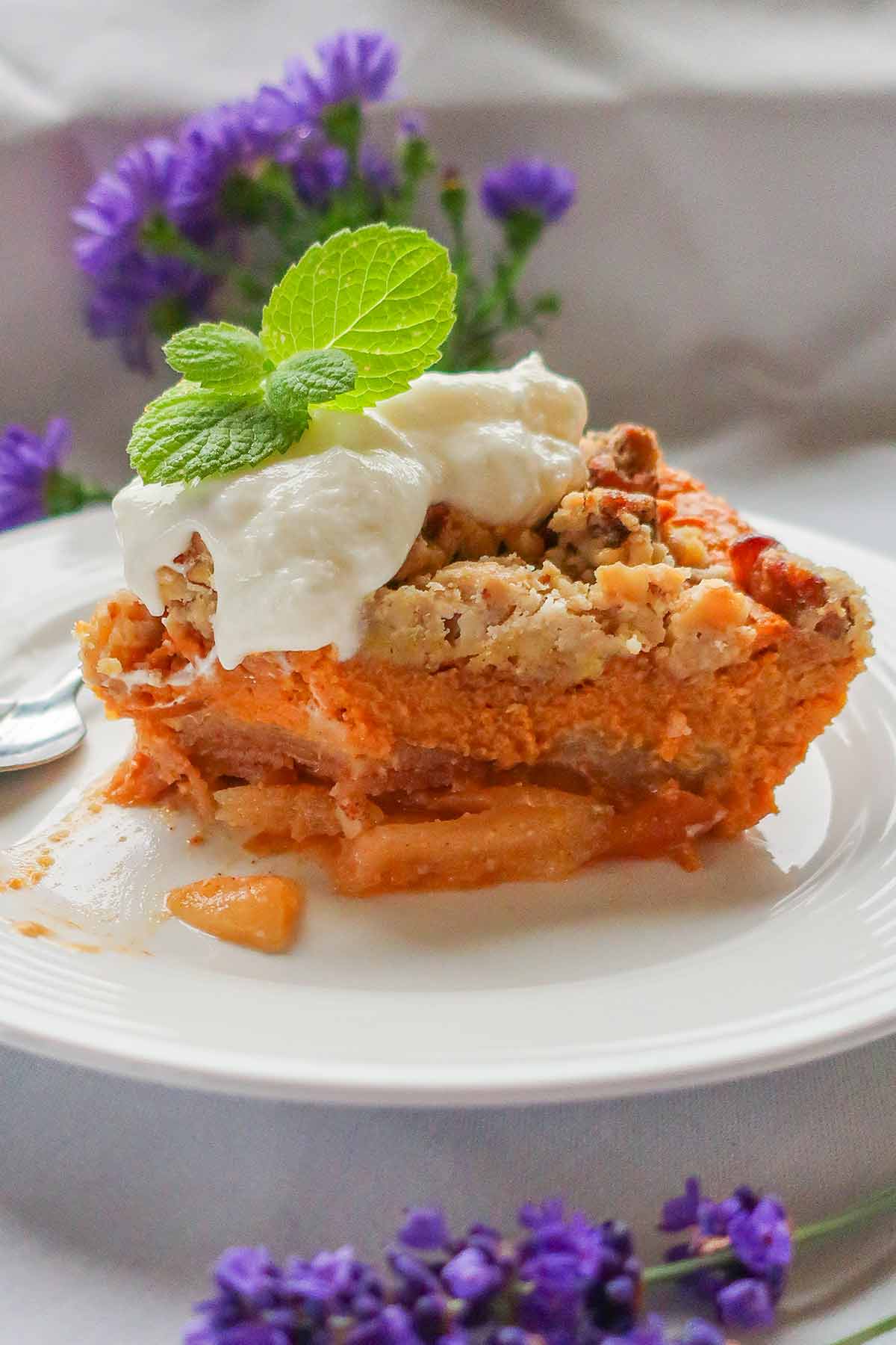 close up of Gluten-Free Apple Pumpkin Crisp Pie with a dollop of whipped cream