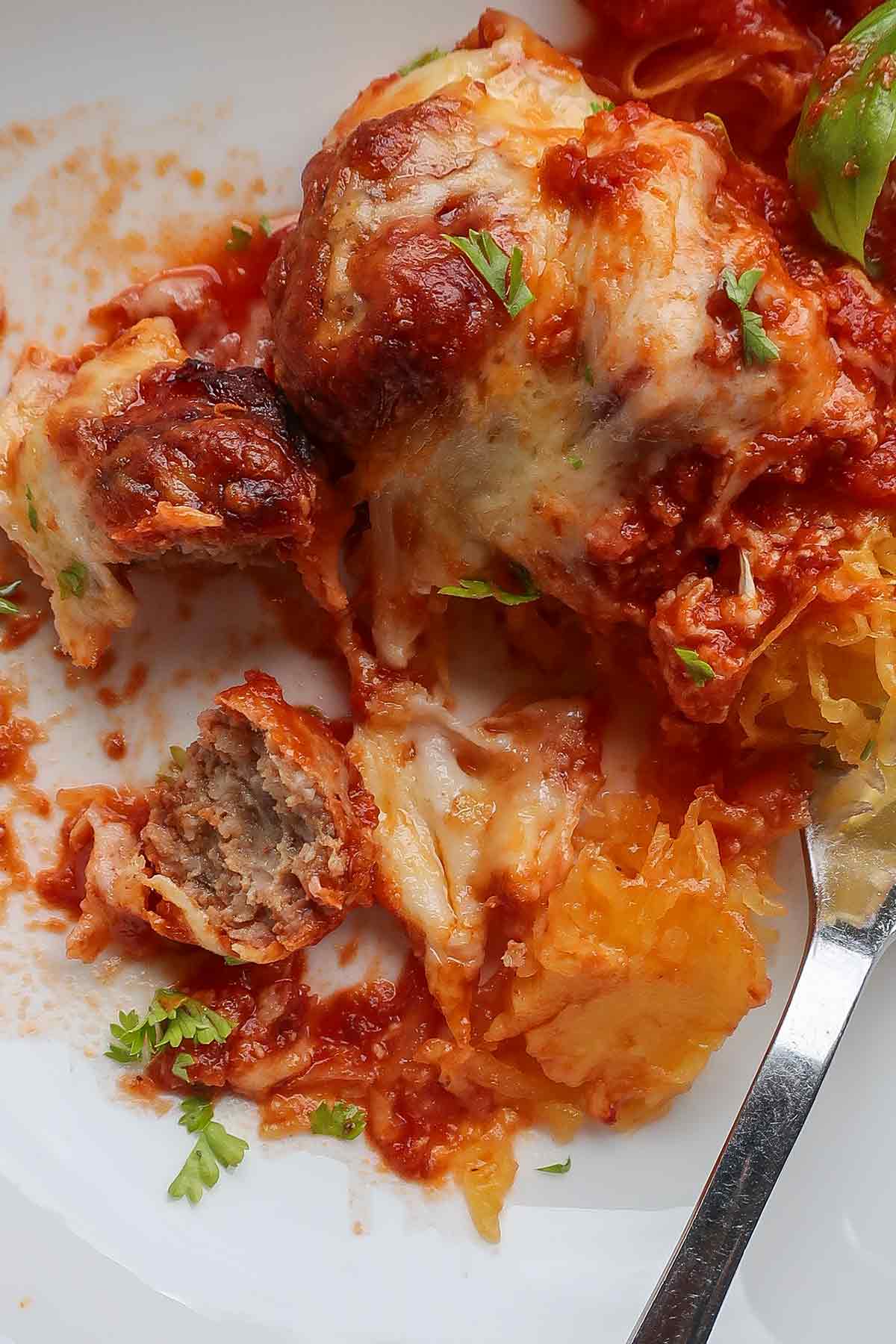 serving of cheese meatballs, marinara sauce and spaghetti squash strands