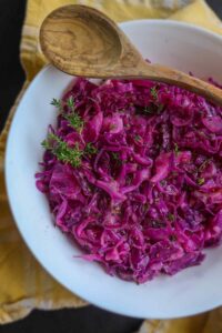 braised red cabbage with apples in a bowl