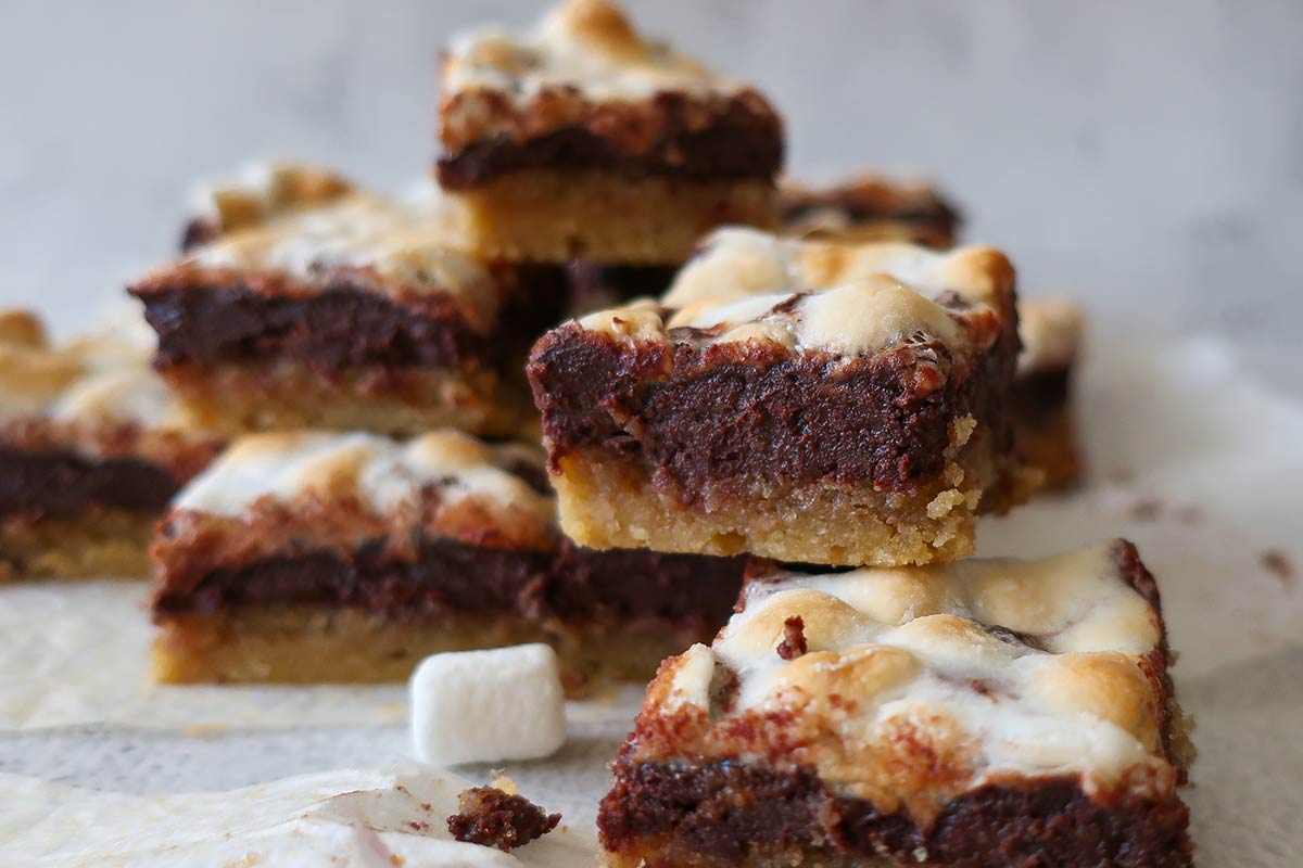4 stacked gluten free marshmallow Nutella brownies on white napkins