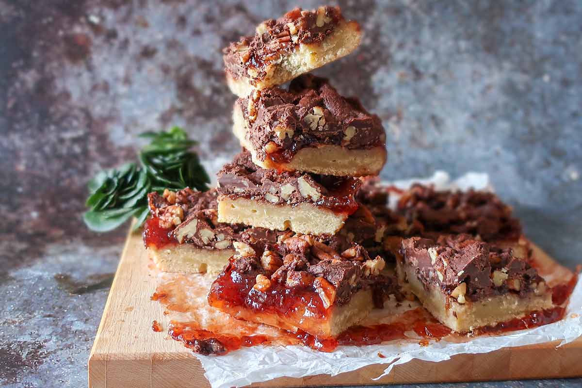 stacked gluten free twin squares on a wooden board