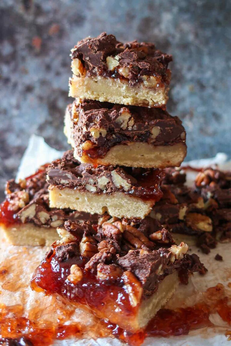4 stacked gluten-free twix squares on a wooden board
